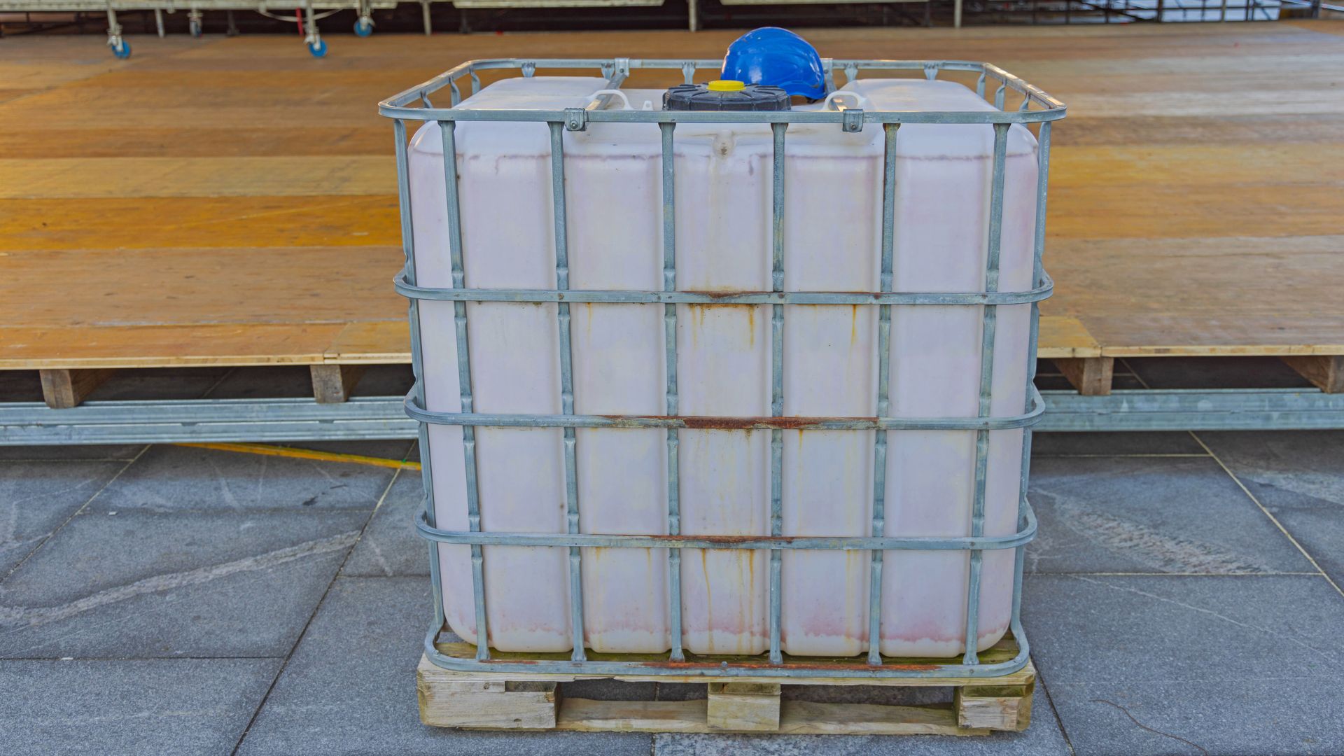 Self-contained water tank system for portable sanitation needs